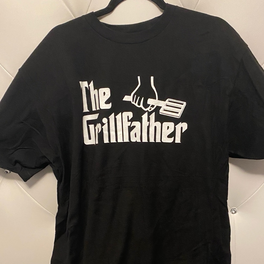 Black Shorts Sleeve Shirt With Grill Fathers written on front. White letters  XL